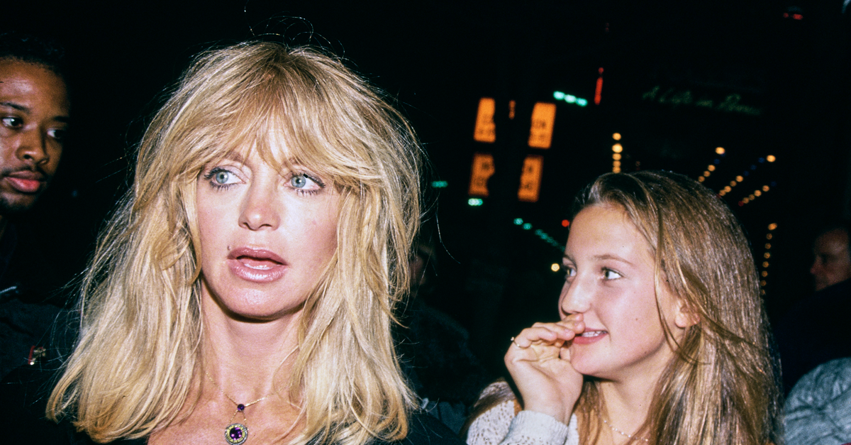 American actress Goldie Hawn, wearing a black outfit, and her daughter, American actress Kate Hudson, attend an event in the Hollywood neighbourhood of Los Angeles, California, 1993.