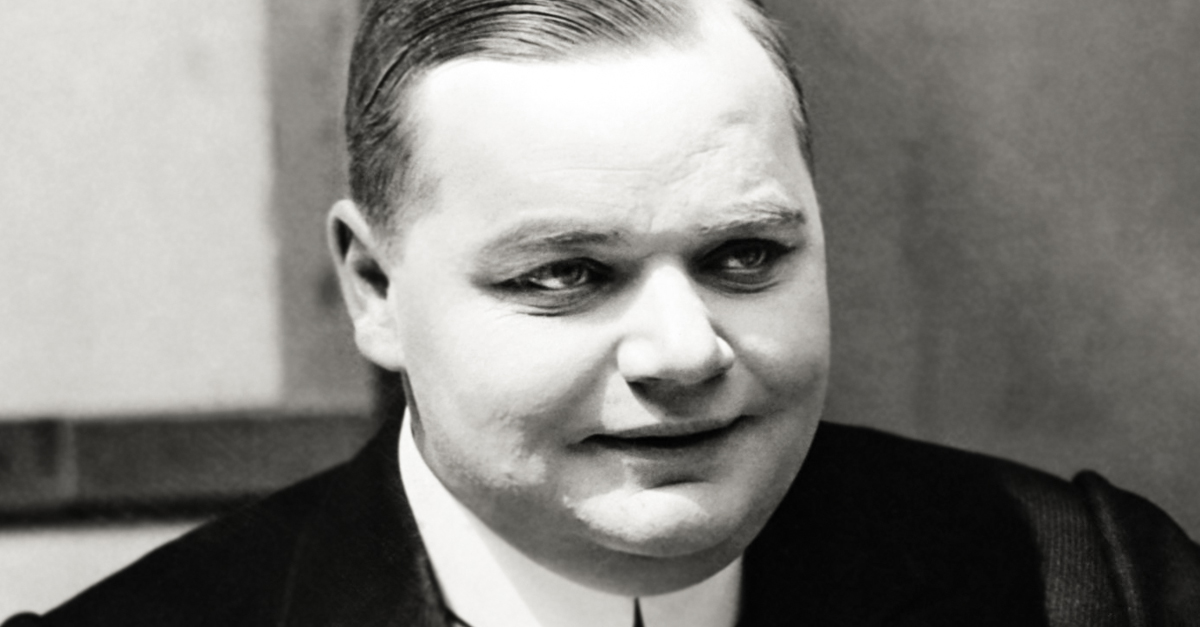 Roscoe "Fatty" Arbuckle with his dog Luke, c. 1919