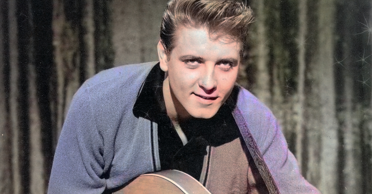 Musician Eddie Cochran performing onstage with his guitar circa 1958.