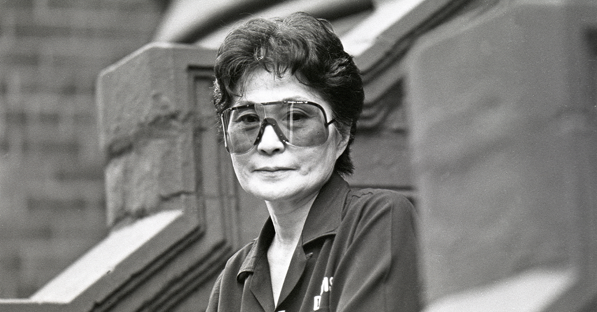 Yoko Ono on sits on a stoop in Manhattan on July 17, 1992.
