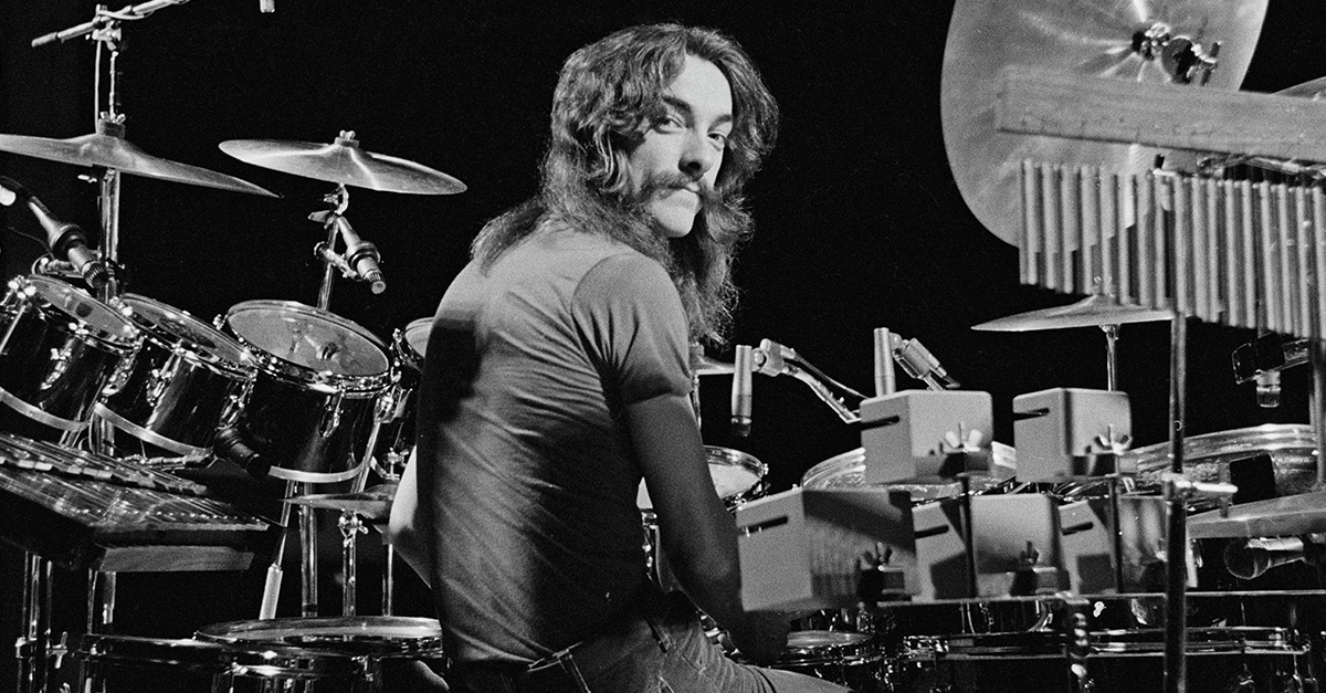 Drummer Neil Peart from Canadian progressive rock band Rush posed at his drum kit in the Public Auditorium in Cleveland, Ohio on 17th December 1977.