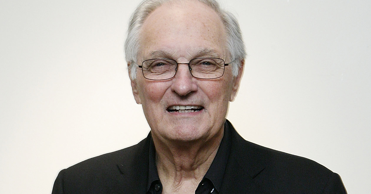 Actor Alan Alda in a black suit