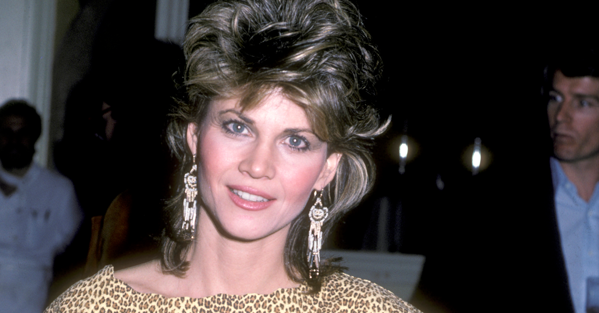 Actress Markie Post with feathered hair leopard print shirt