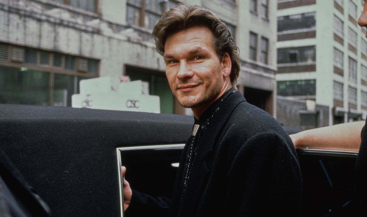 American actor and dancer Patrick Swayze (1952 - 2009) getting into a car, circa 1996.