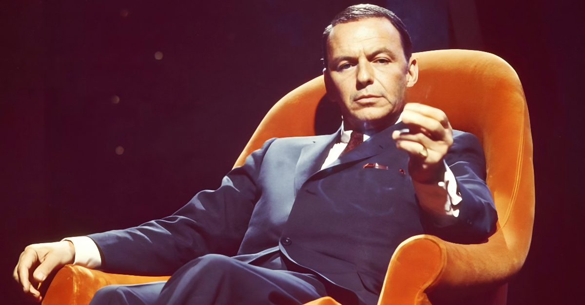 Frank Sinatra in an orange armchair