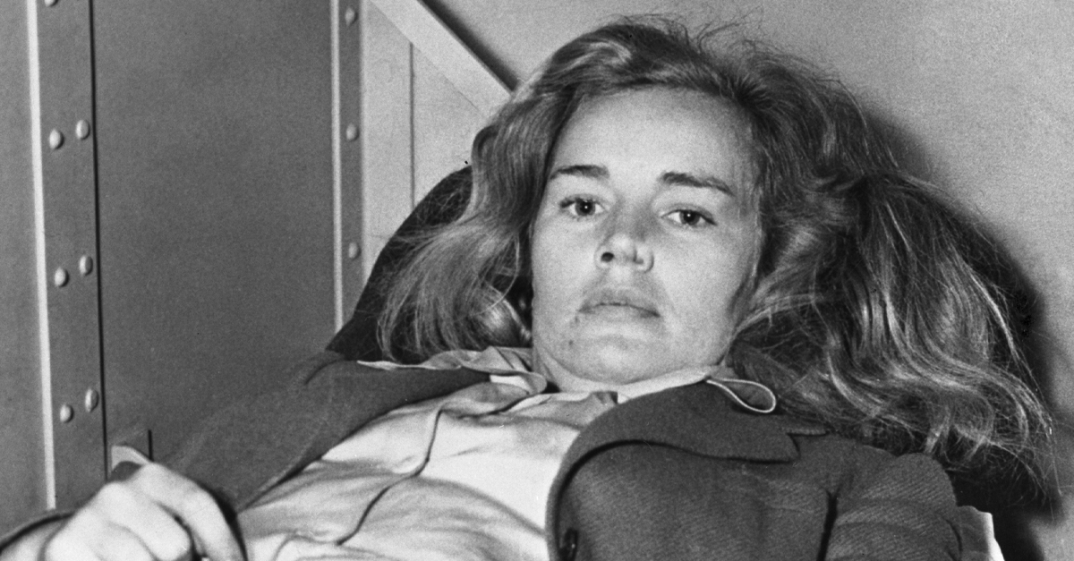 dishevelled blonde woman frances farmer lying on a bed