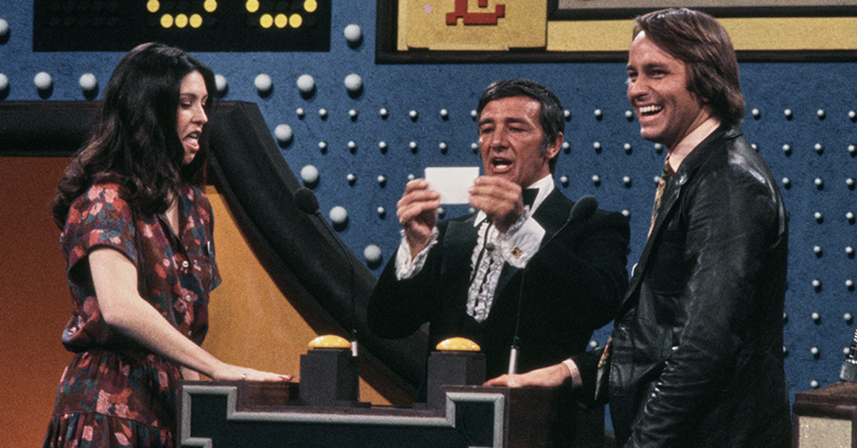 Host Richard Dawson (centre) asking a question for the American actors Diana Canova and John Ritter during the ABC television show 'All-Star Family Feud Special', United States, 1978. The casts of 'The Love Boat', 'Eight is Enough', 'Three's Company', and