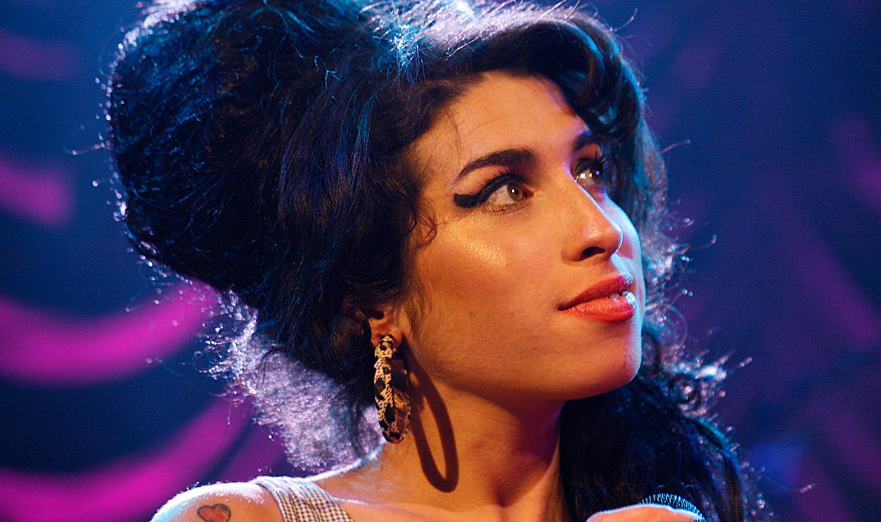 Amy Winehouse performing on stage