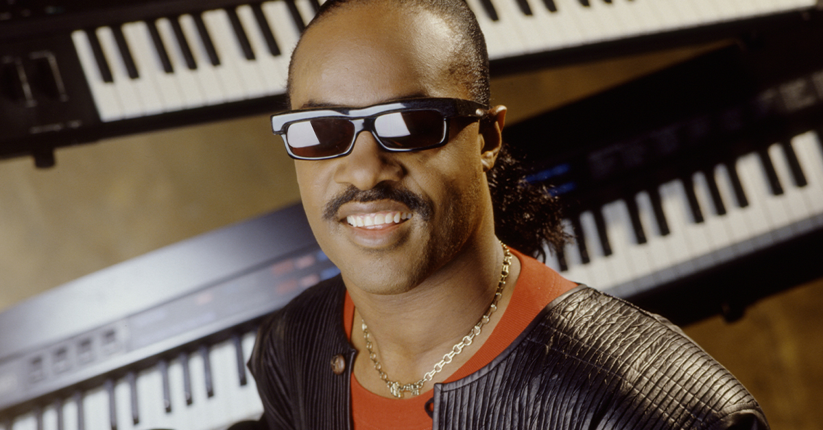 Stevie Wonder in the 1980s, surrounded by keyboards.