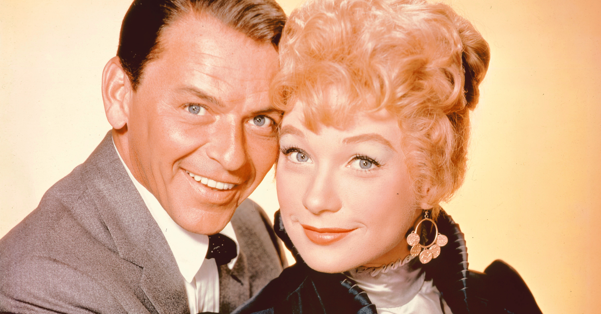 Frank Sinatra and Shirley MacLaine pose for a studio portrait