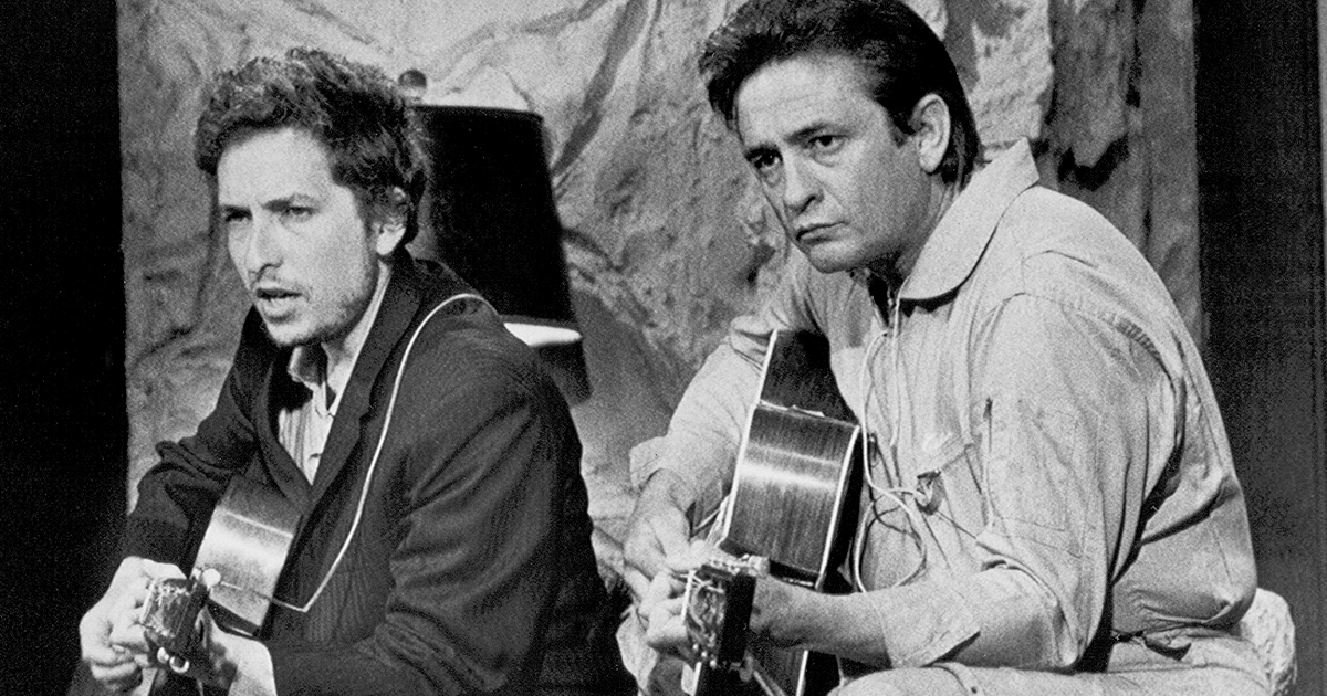 Black and white photo of Bob Dylan and Johnny Cash