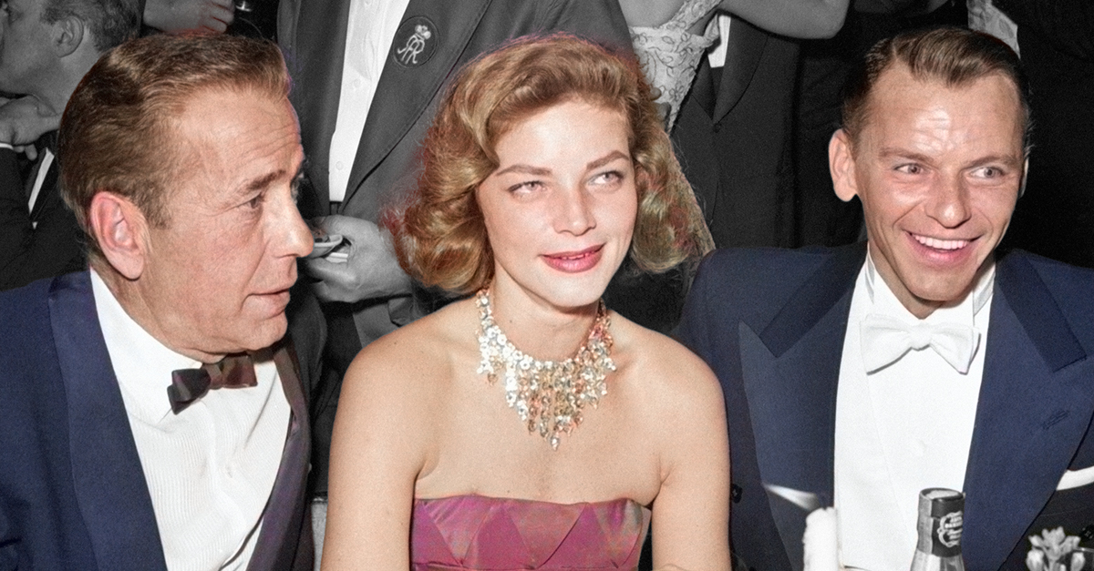 Humphrey Bogart, Lauren Bacall and Frank Sinatra seated together at table during Hollywood event circa 1956.