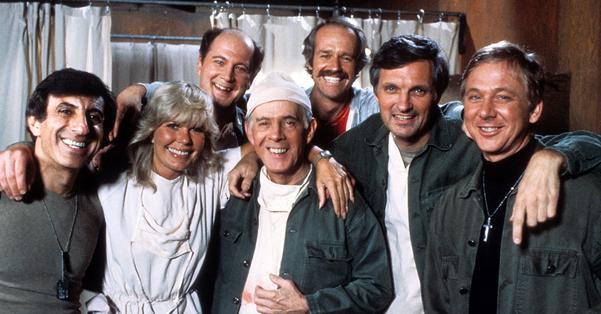 Jamie Farr, Loretta Swit, David Ogden Stiers, Harry Morgan, Mike Farrell, Alan Alda, and William Christopher in publicity portrait for the film 'M*A*S*H', Circa 1978
