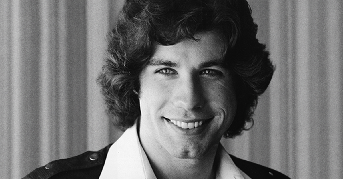 Actor John Travolta smiles in a photograph, late 1970s