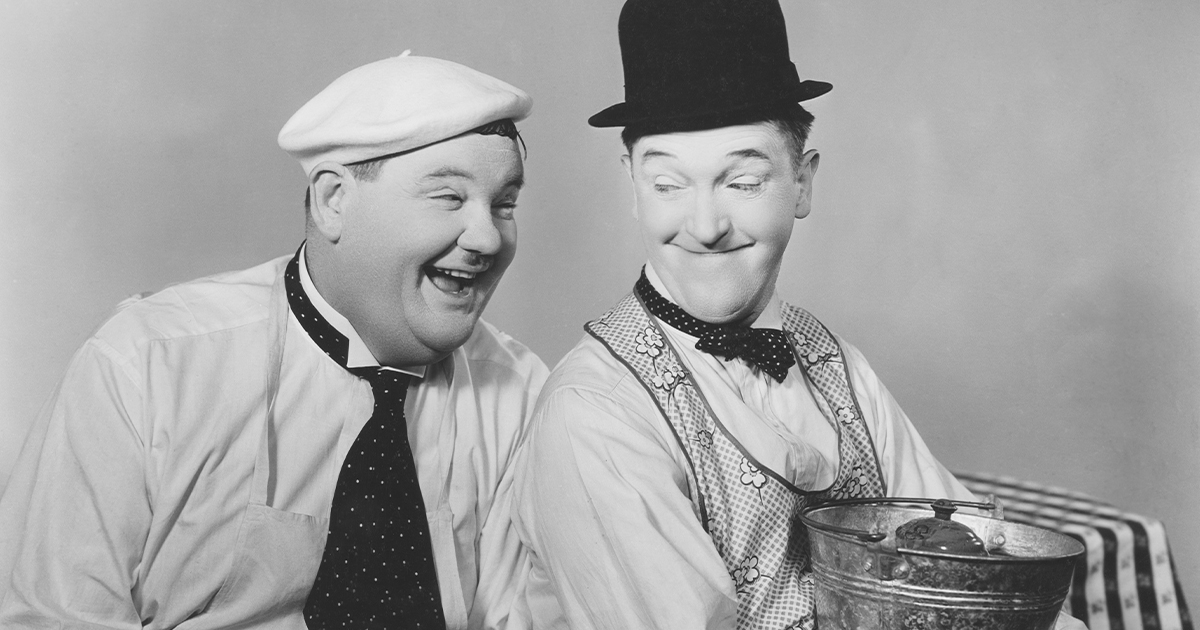 Black and white portrait of Stan Laurel and Oliver Hardy
