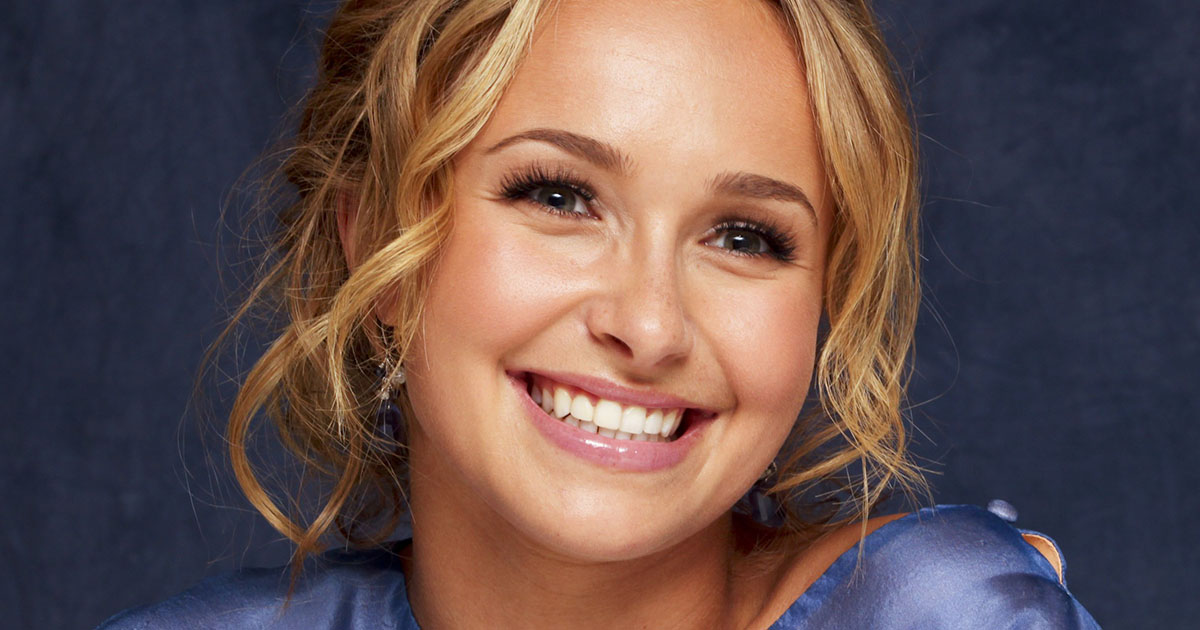 Hayden Panettiere wearing a blue shirt with a blonde up-do