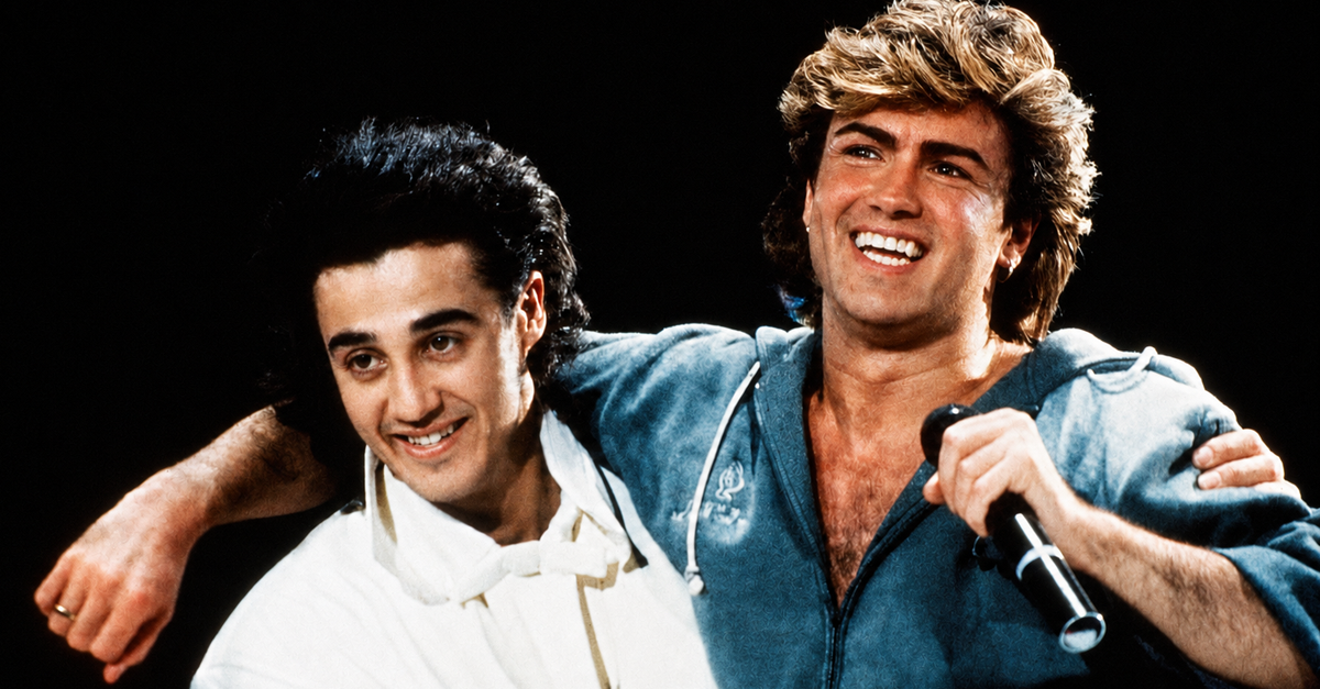 Andrew Ridgeley and George Michael of Wham performing on stage in 1985