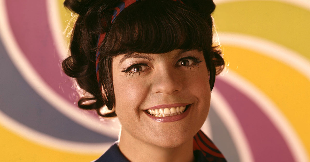 Jo Anne Worley colorful smiling vintage studio pose.