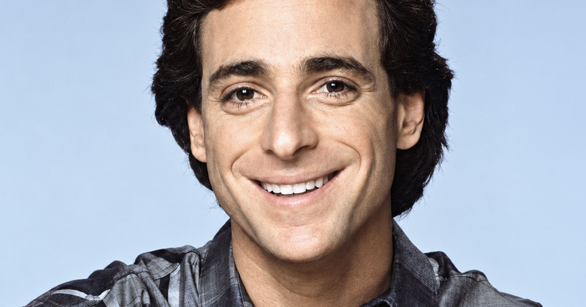 Bob Saget wearing a grey plaid shirt